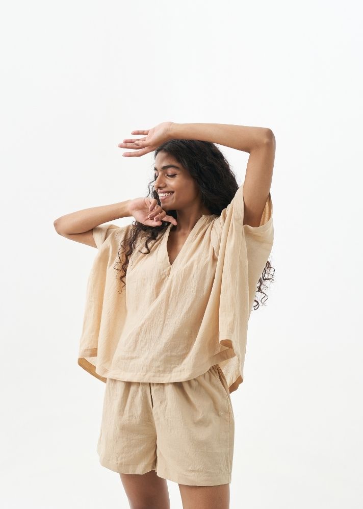 A Model Wearing Beige Handwoven Cotton Sand shorts set, curated by Only Ethikal