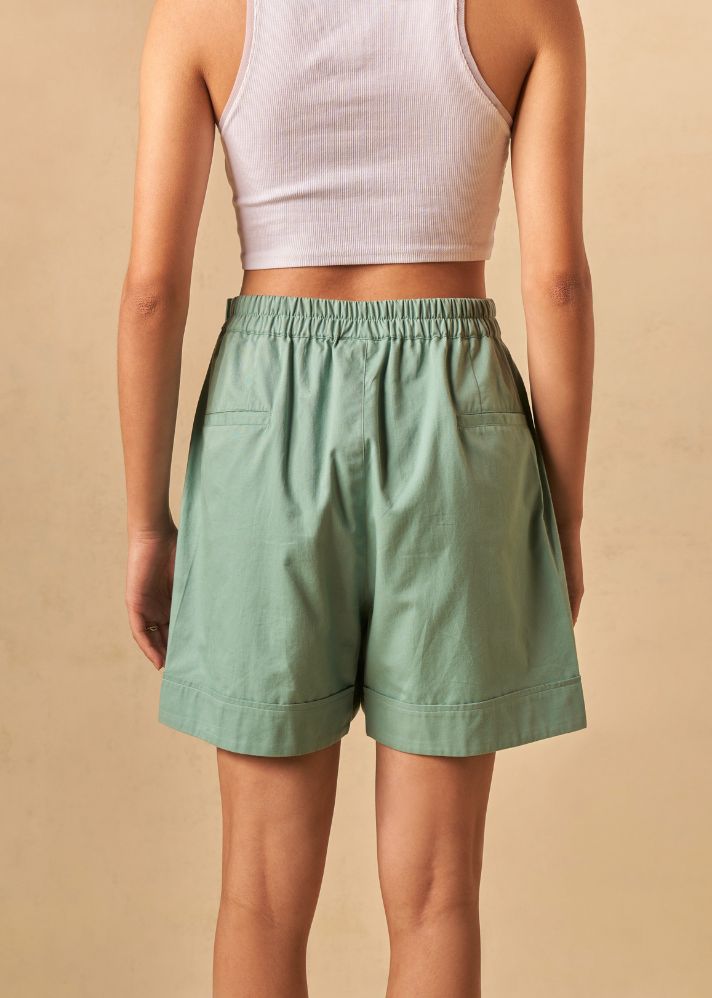 A Model Wearing Green Organic Cotton The Ocean Tide organic cotton shorts, curated by Only Ethikal