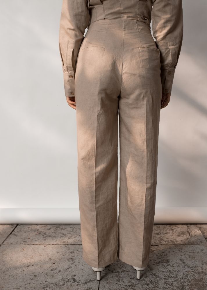 A Model Wearing Beige Hemp Tailored Pleated Pants, curated by Only Ethikal