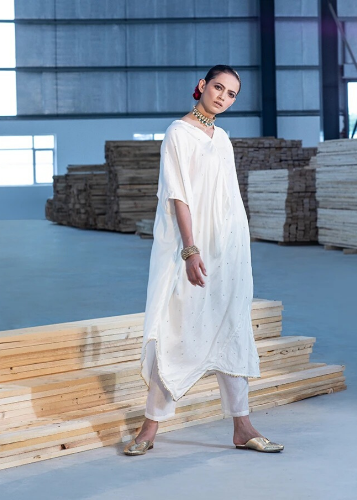 young woman in white Ivory kaftan and pants set  made of sustainable materials curated by onlyethikal