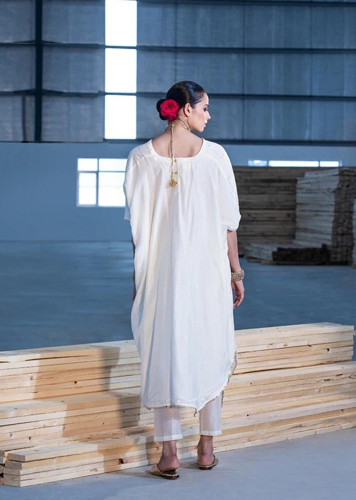 young woman in white Ivory kaftan and pants set  made of sustainable materials curated by onlyethikal