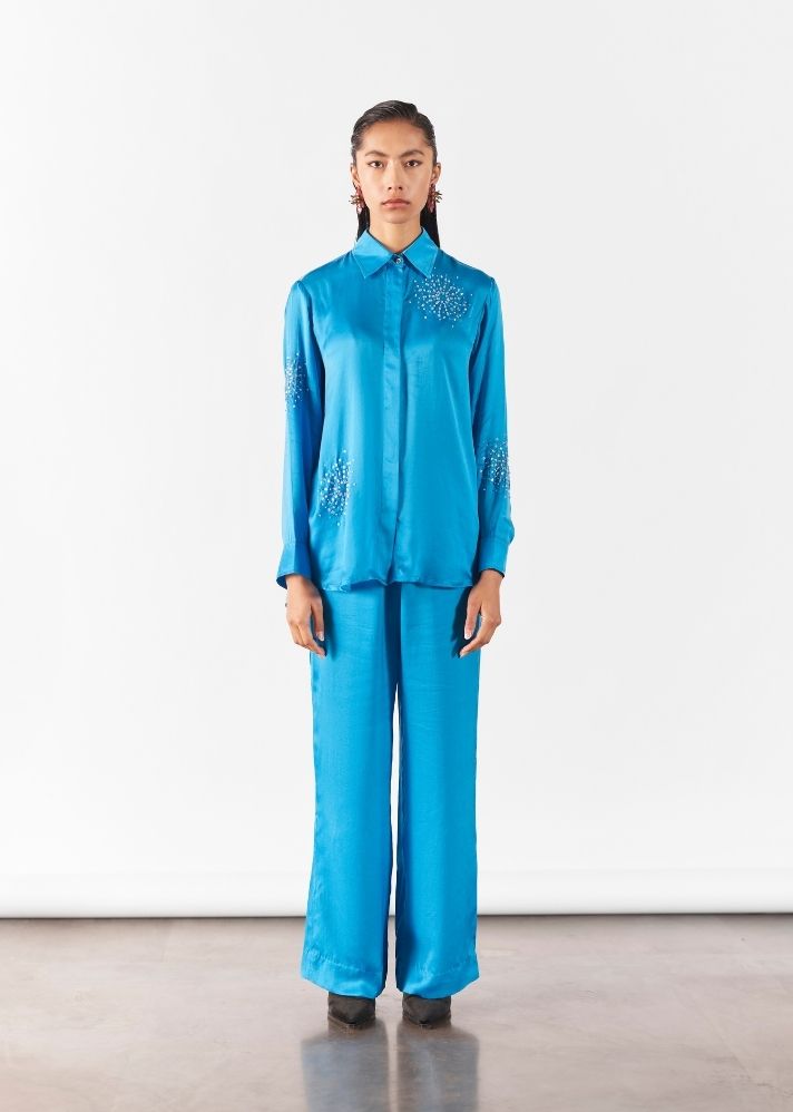 A Model Wearing Blue Organic Cupro Cyan Brunia Shirt And Trousers Co-Ord, curated by Only Ethikal