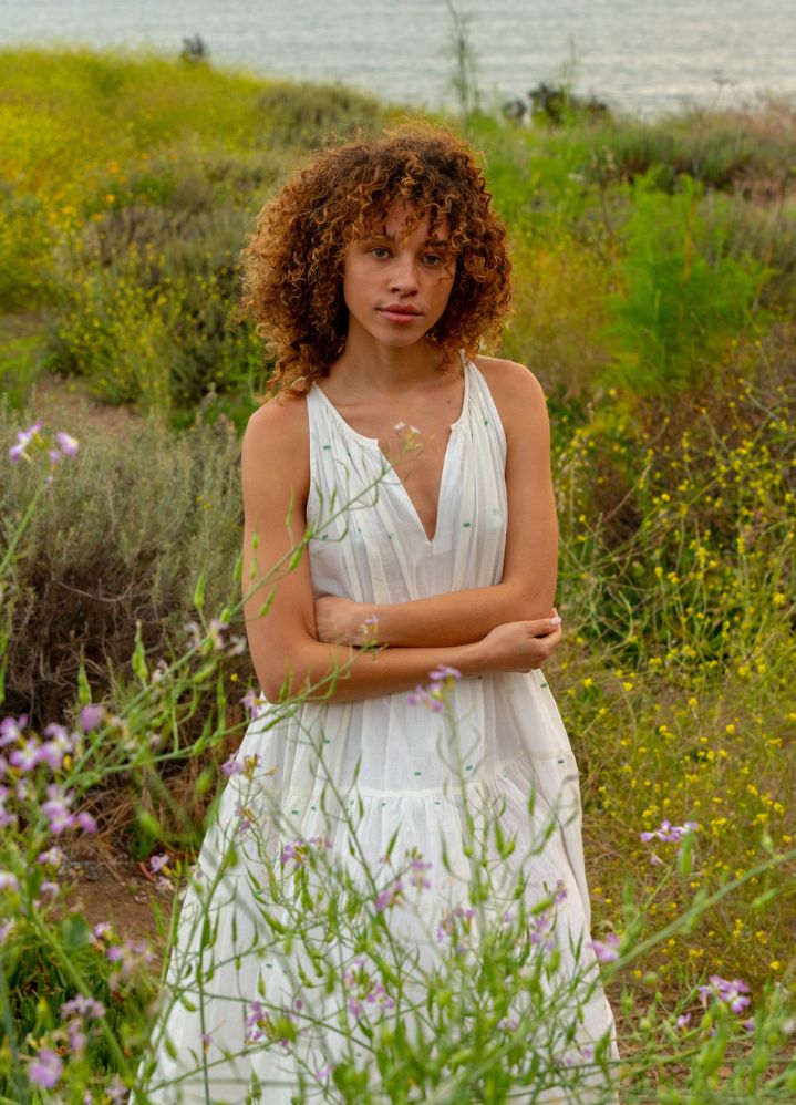 A Model Wearing White Handwoven Cotton Off white tiered midi dress, curated by Only Ethikal