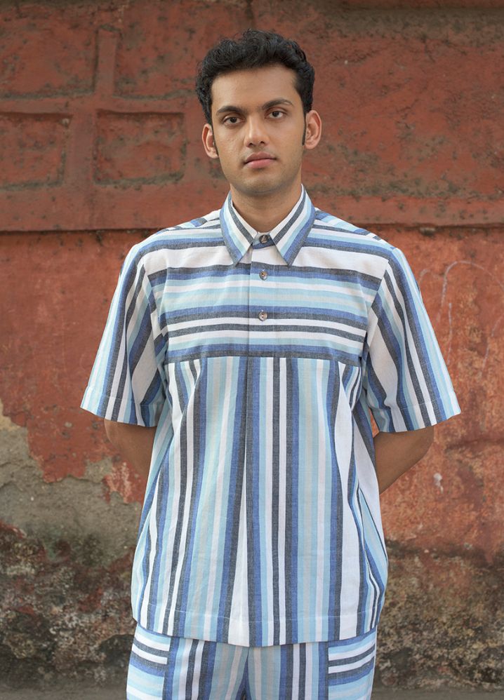 A model wearing Striped Multicolor Handwoven Cotton Panelled T-Shirt, curated by Only Ethikal