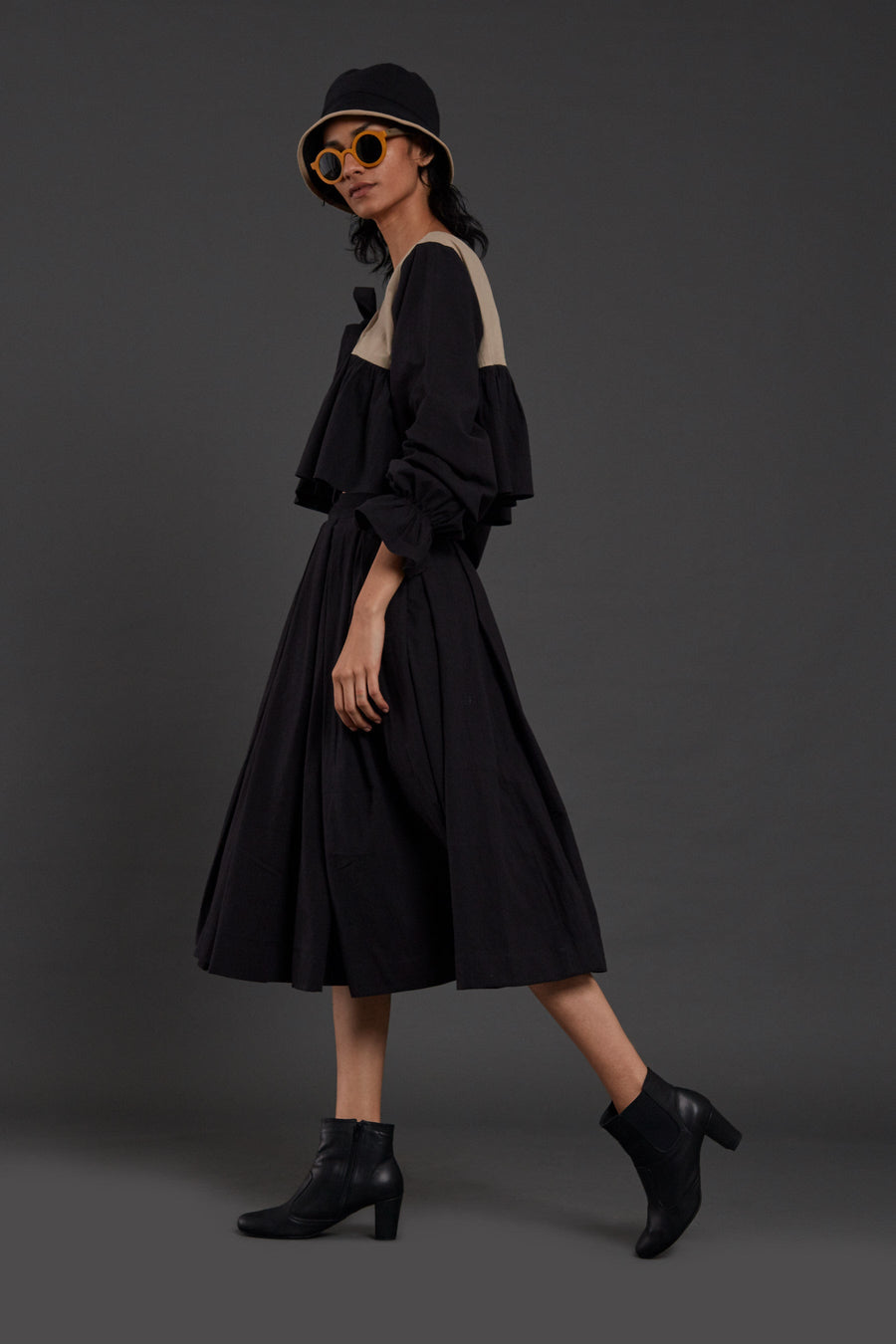 A Model Wearing Black Pure Cotton Aw Black Pleated Skirt, curated by Only Ethikal