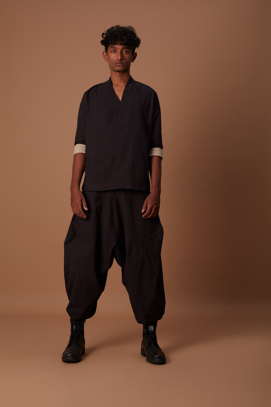 A Model Wearing Black Pure Cotton Black & Beige Overlap Baggy Set, curated by Only Ethikal