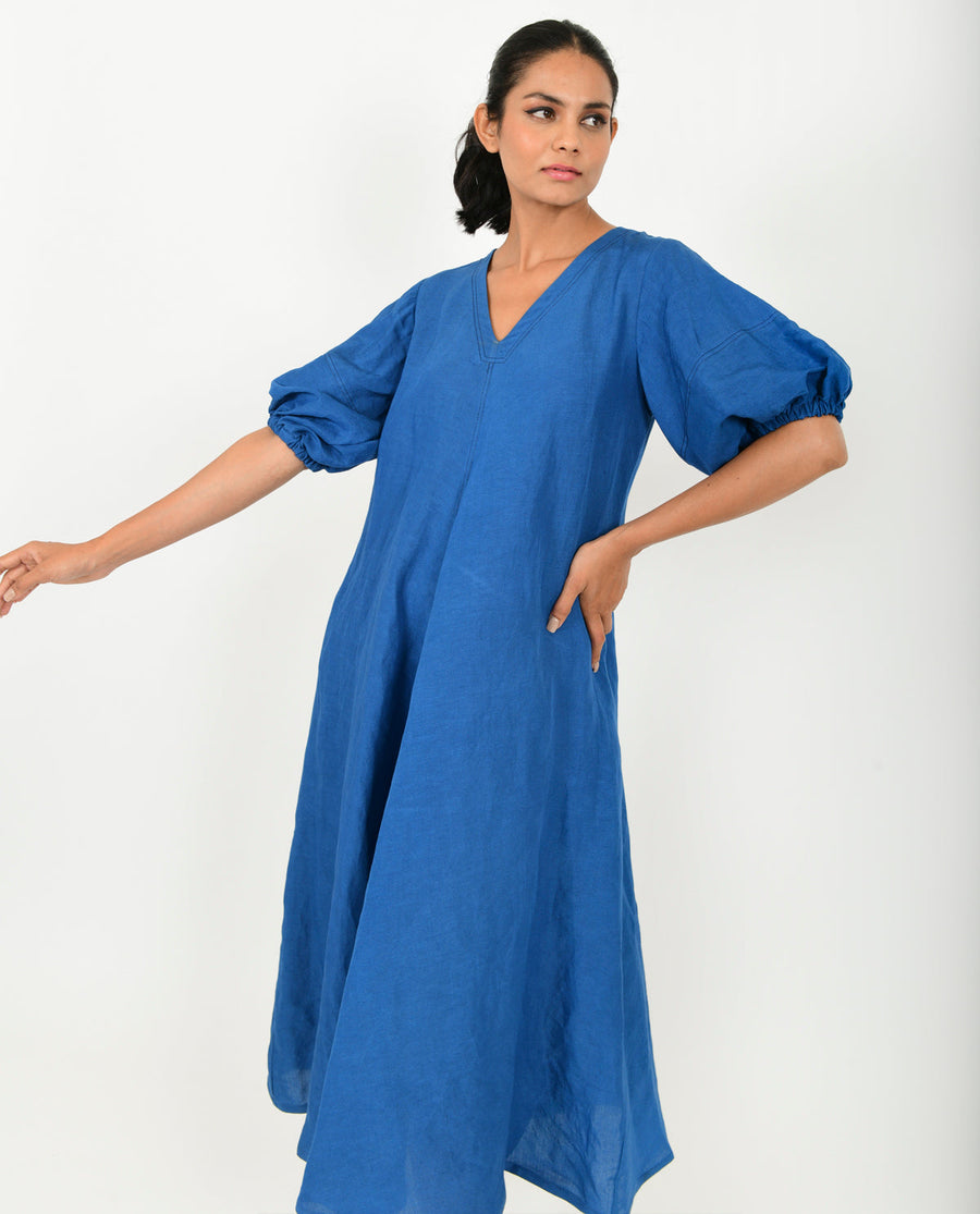 A Model Wearing Blue Organic Cotton Classic Blue Cotton Dress With Puffed Sleeves , curated by Only Ethikal