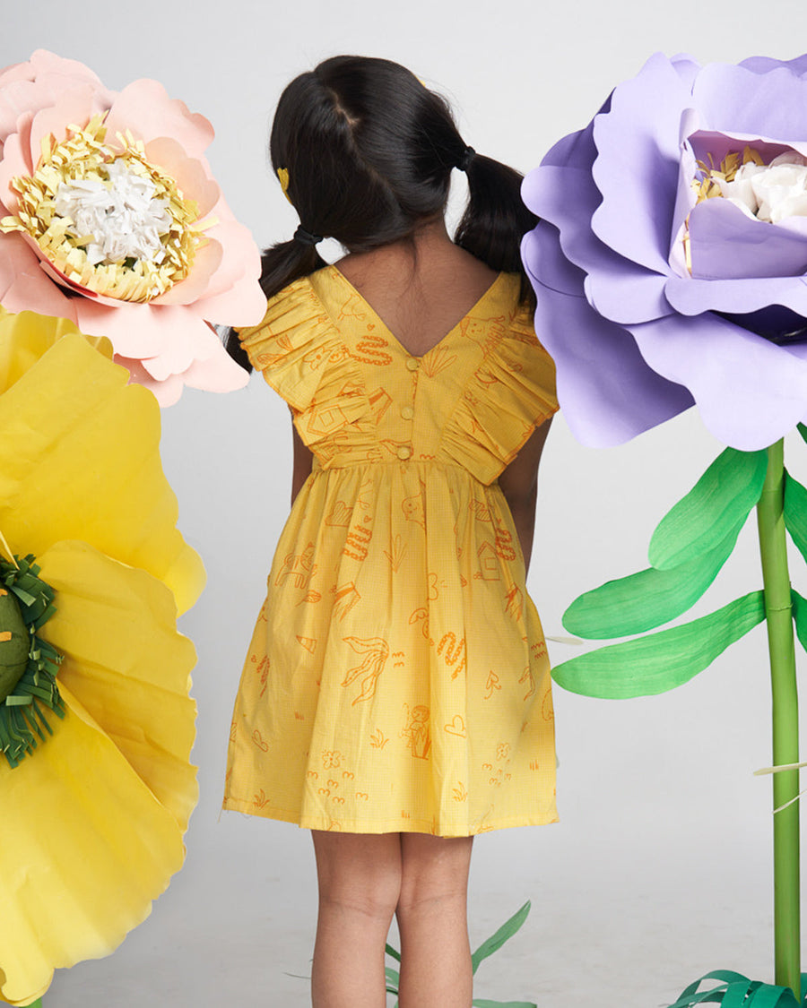 A Model Wearing yellow Organic Cotton Miko Lolo Wonder Wander Ruffle Dress, curated by Only Ethikal