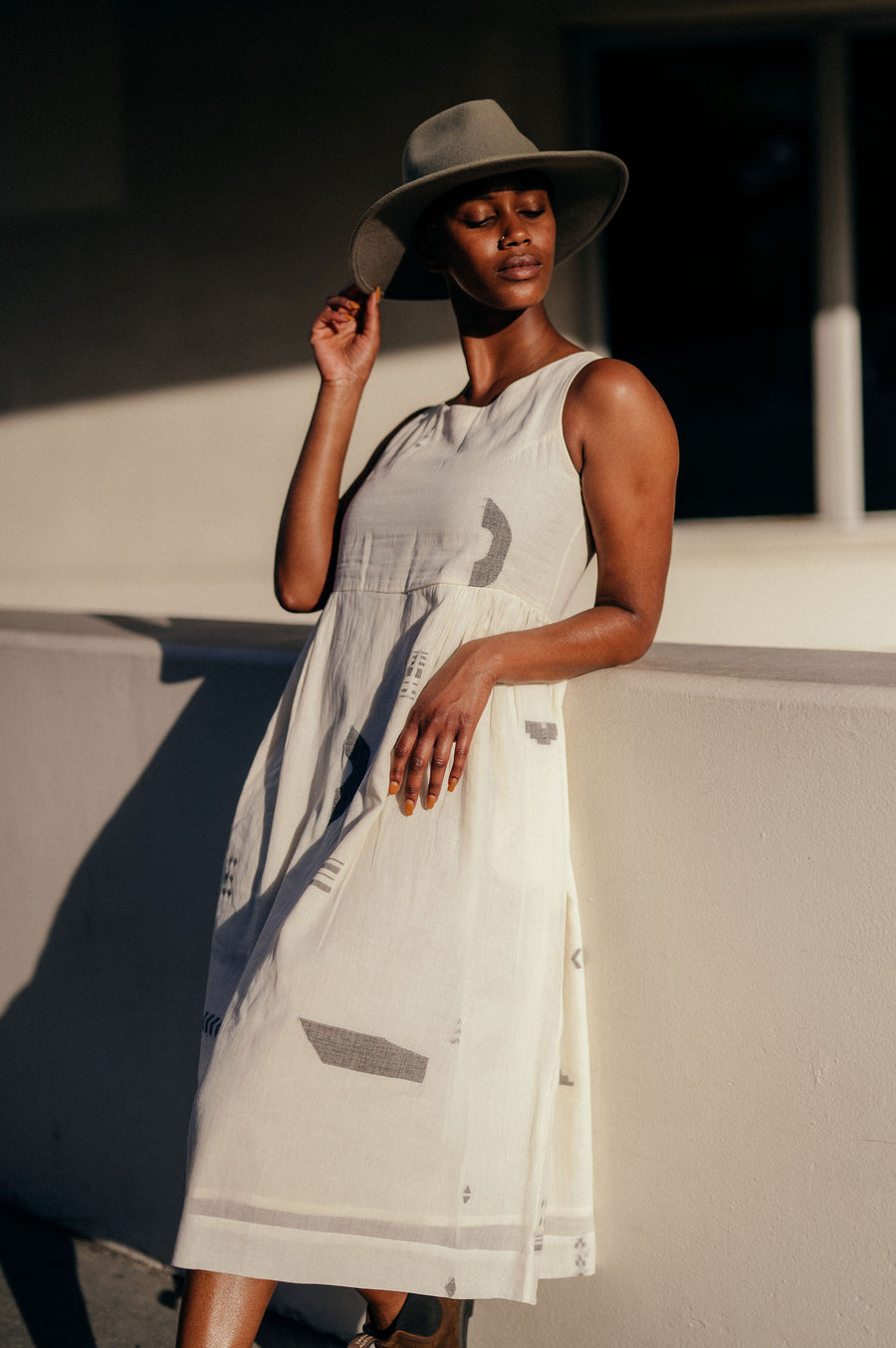 A Model Wearing White Handwoven Cotton Ivory Gathered Midi Dress, curated by Only Ethikal