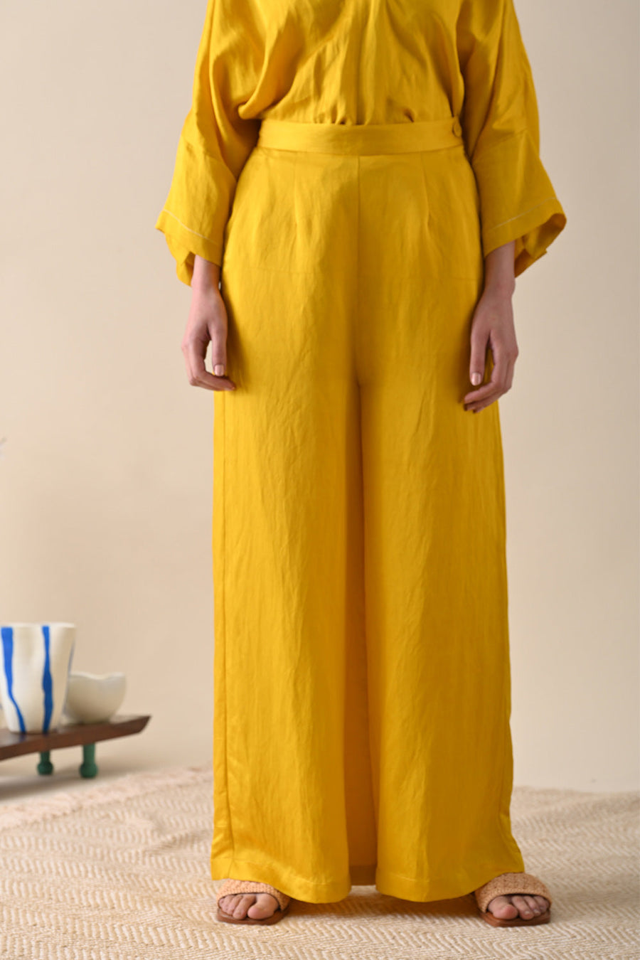 A Model Wearing Yellow Modal Satin Vita Trouser, curated by Only Ethikal