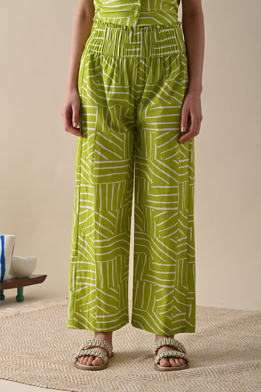 A Model Wearing Green Pure Cotton River Olive Print Trouser, curated by Only Ethikal