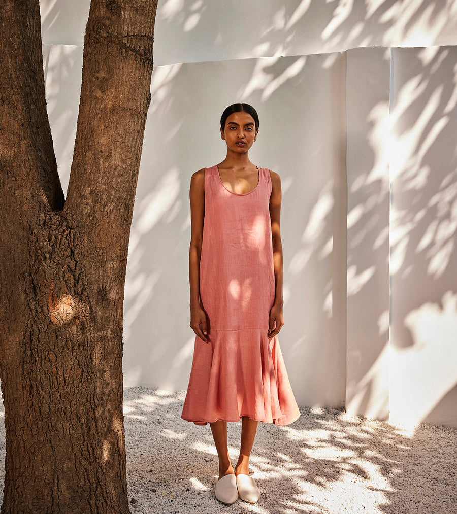 A Model Wearing Peach Linen Soft Gaze Midi Dress, curated by Only Ethikal