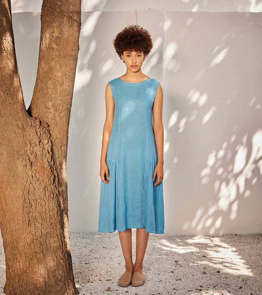 A Model Wearing Blue Linen When It Rains Midi Dress, curated by Only Ethikal