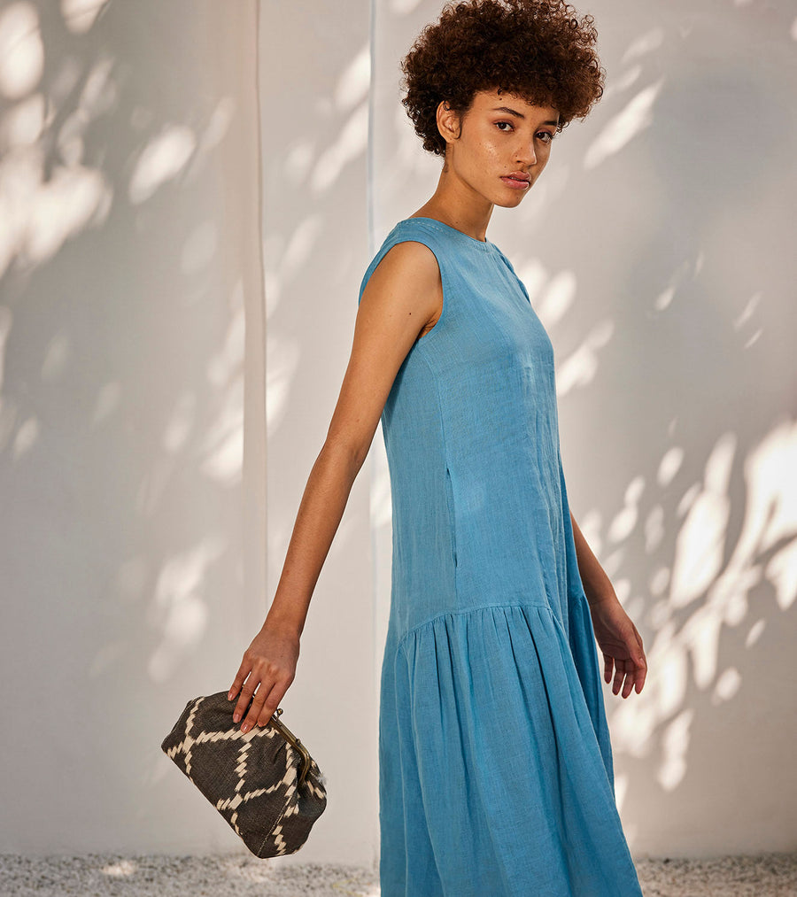 A Model Wearing Blue Linen When It Rains Midi Dress, curated by Only Ethikal