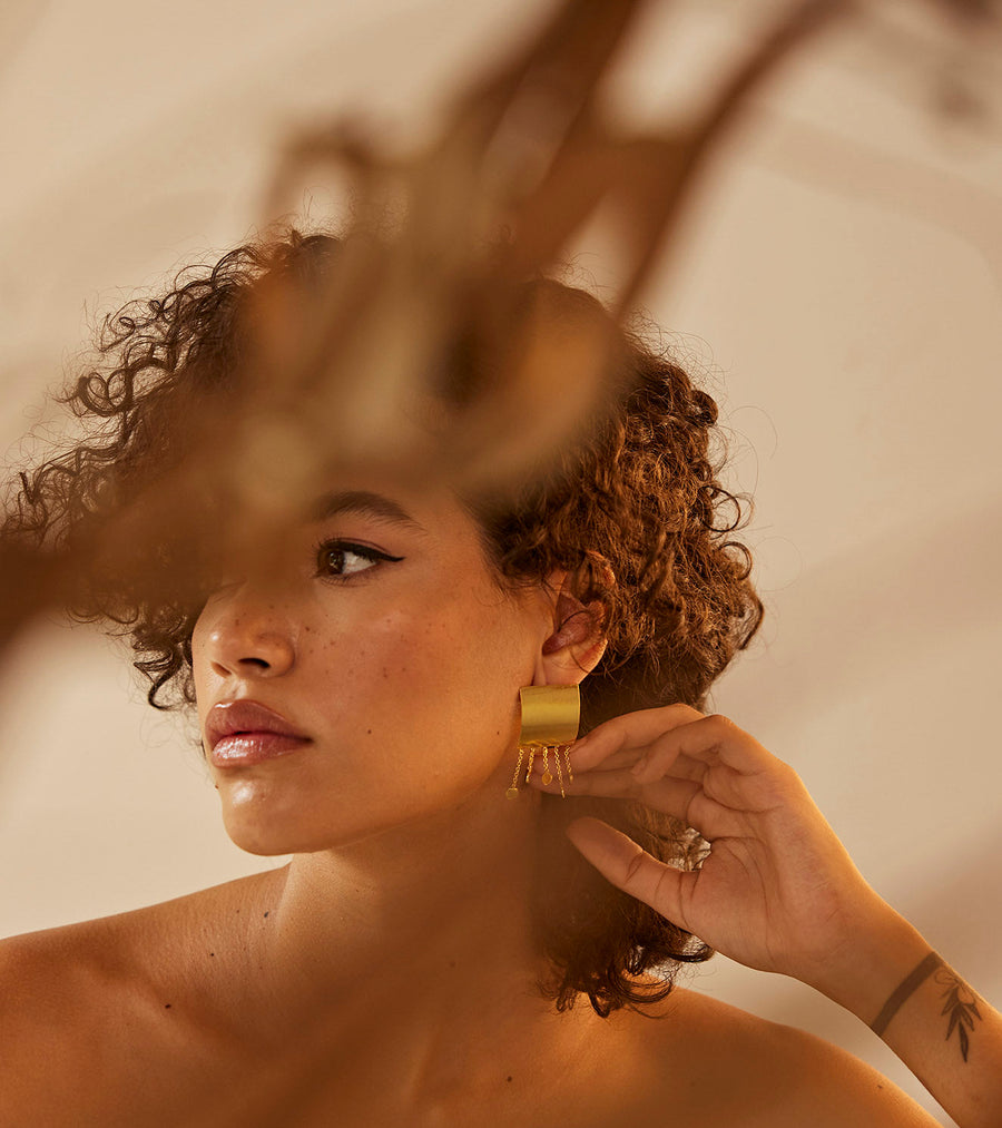 A Model Wearing Yellow 1 micron gold plated. Jhomaar Earring, curated by Only Ethikal
