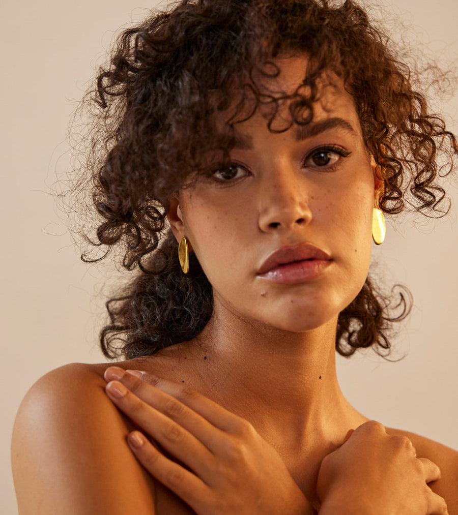 A Model Wearing Yellow 1 micron gold plated. Akara Earring, curated by Only Ethikal