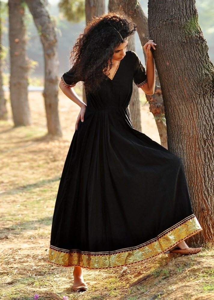 young woman in Kharakapas Black Ornamental dress curated by onlyethikal