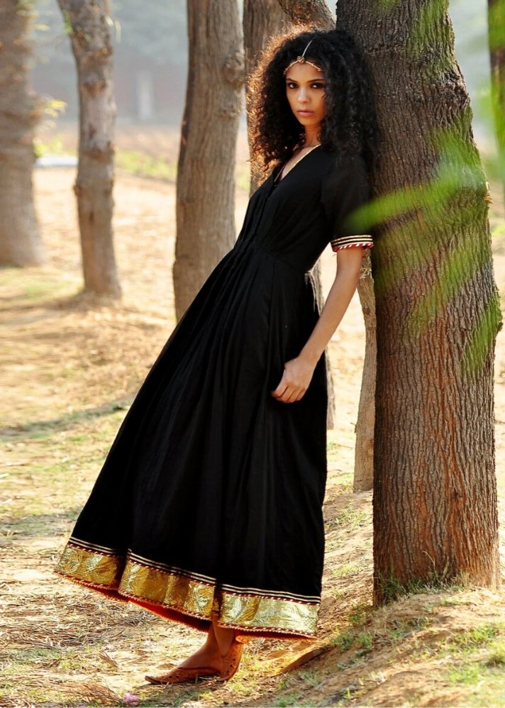 young woman in Kharakapas Black Ornamental dress curated by onlyethikal