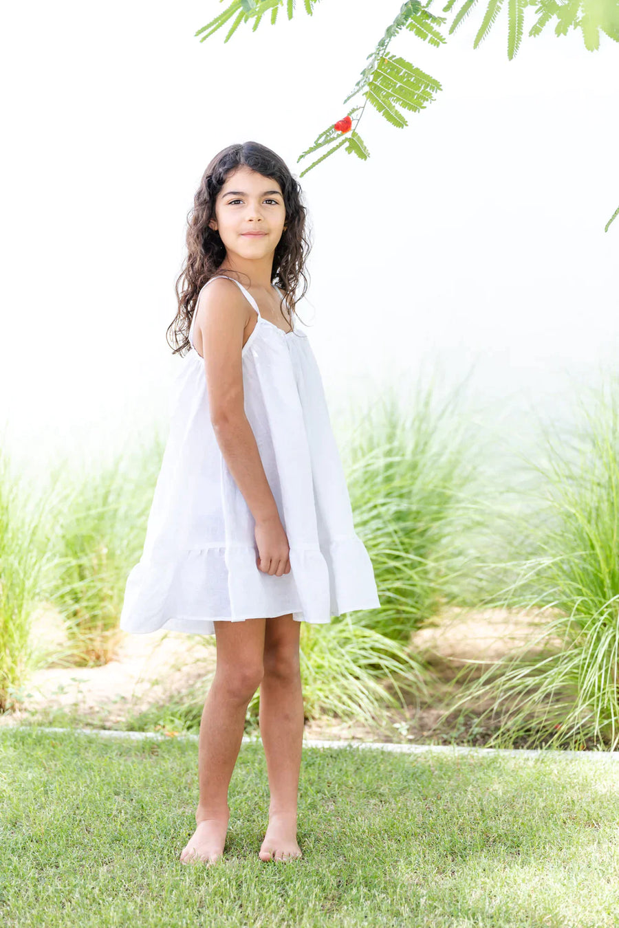 A Model Wearing White Linen Zunairah Linen Dress , curated by Only Ethikal