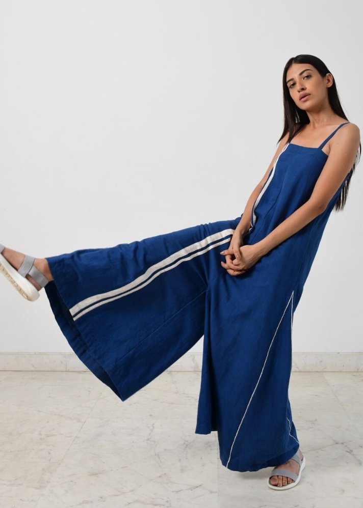 young woman wearing blue Indigo strappy jumpsuit curated by onlyethikal