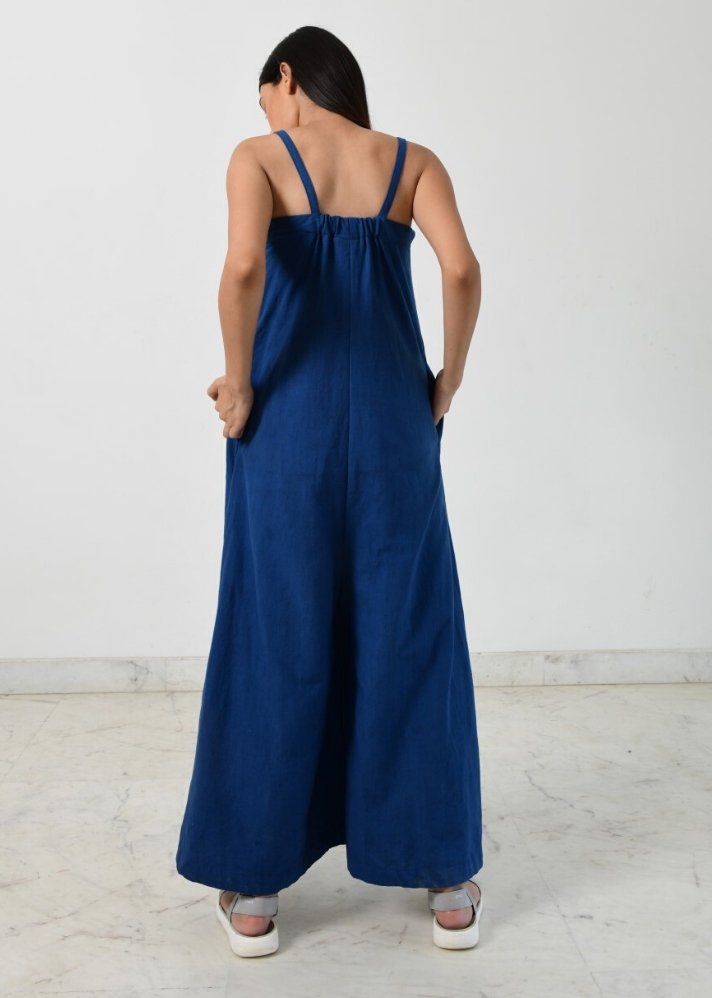 young woman wearing blue Indigo strappy jumpsuit curated by onlyethikal