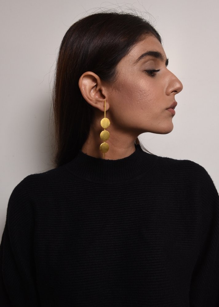 yong woman wearing One two three Gold plated  earring curated by onlyethikal